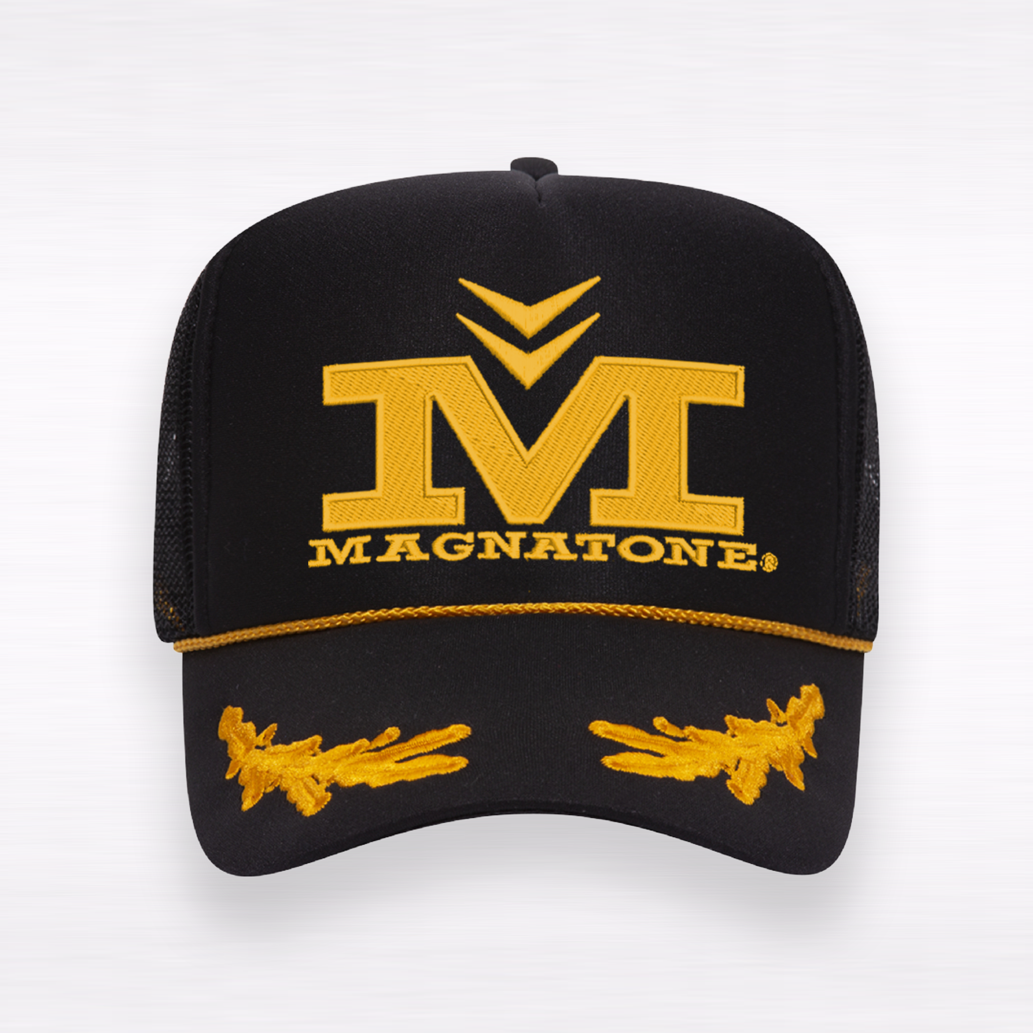 Black cap with yellow Magnatone logo on a white background