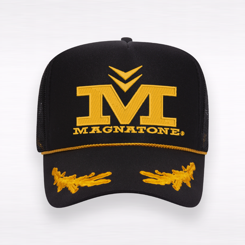 Black cap with yellow Magnatone logo on a white background